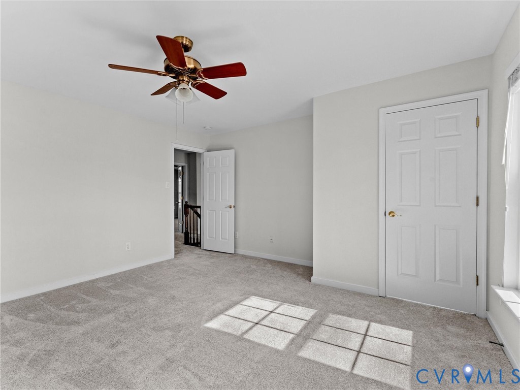 9524 Spring Moss Terrace, Unit 9524 Glen Allen, VA 23060 - Photo 35 of 41 a view of an empty room with a ceiling fan