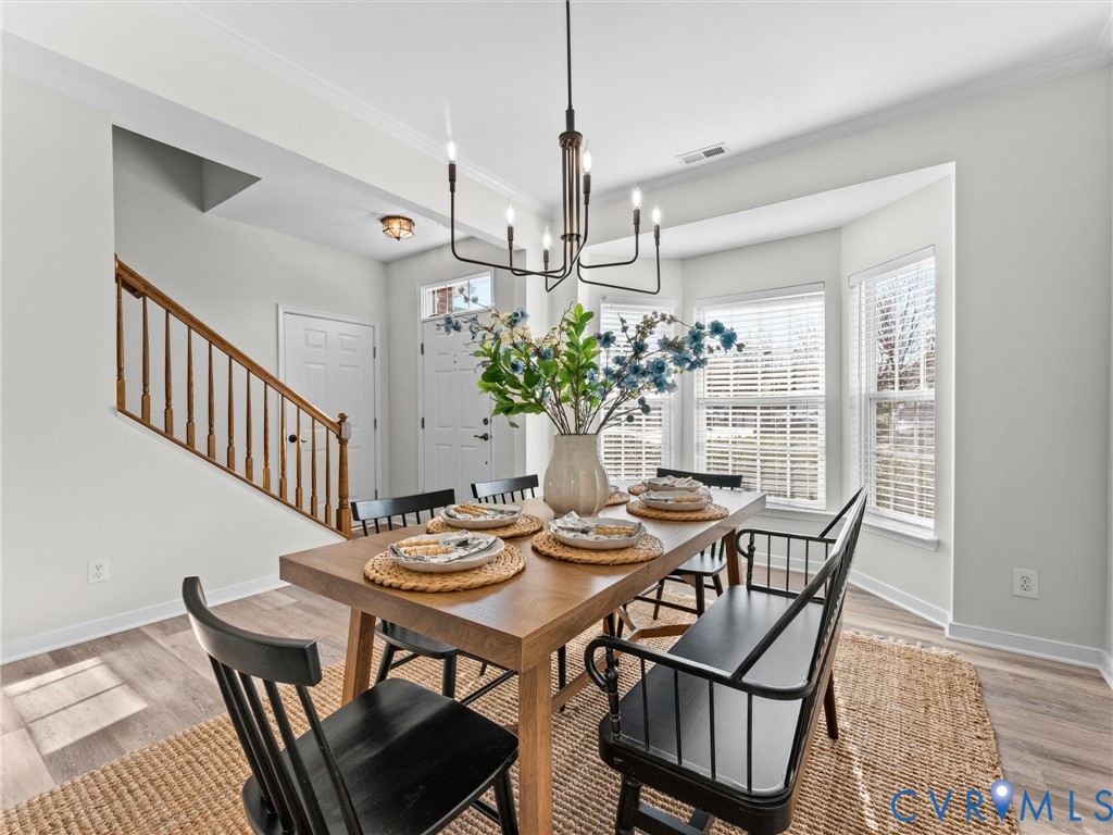 9524 Spring Moss Terrace, Unit 9524 Glen Allen, VA 23060 - Photo 5 of 41 a view of a dining room with furniture