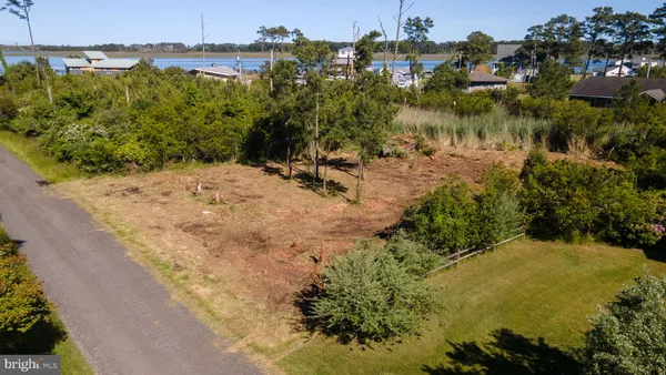 a view of a lake with a yard