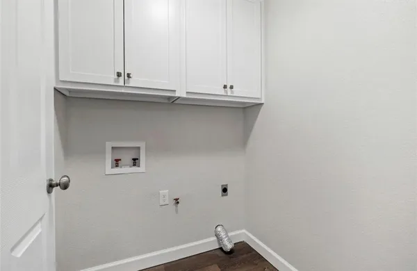 a bathroom with a sink and cabinets