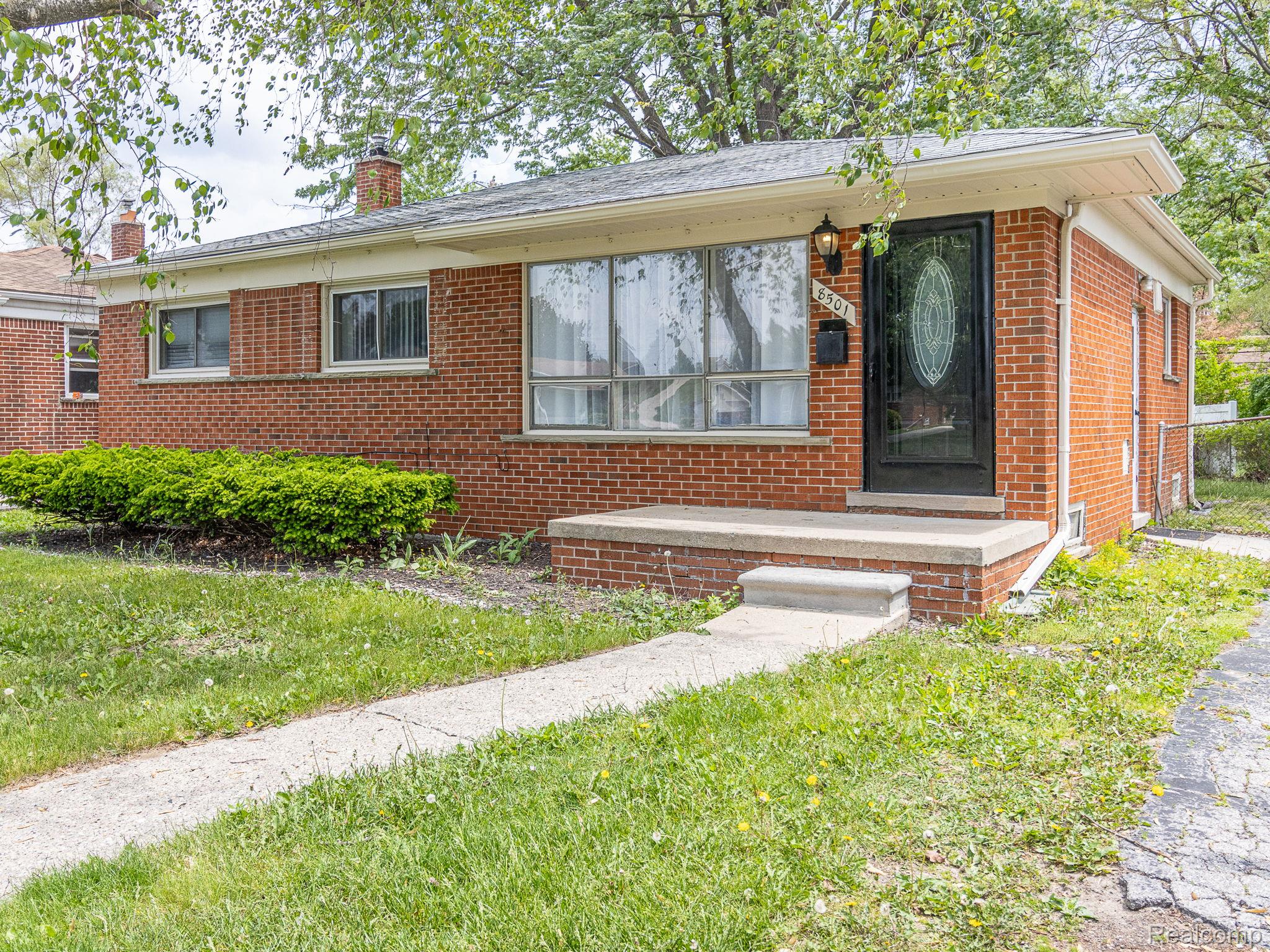 8501 Allen Road Allen Park, MI 48101 - Photo 24 of 27 Ranch-style house with brick siding, a front lawn, and a chimney