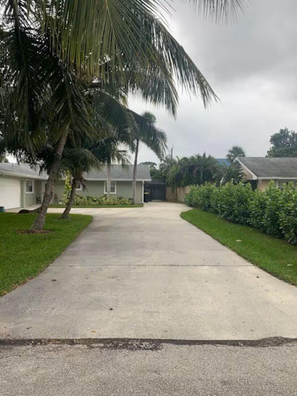 4796 Southeast Manatee Terrace Stuart, FL 34997 - Photo 4 of 18 long driveway