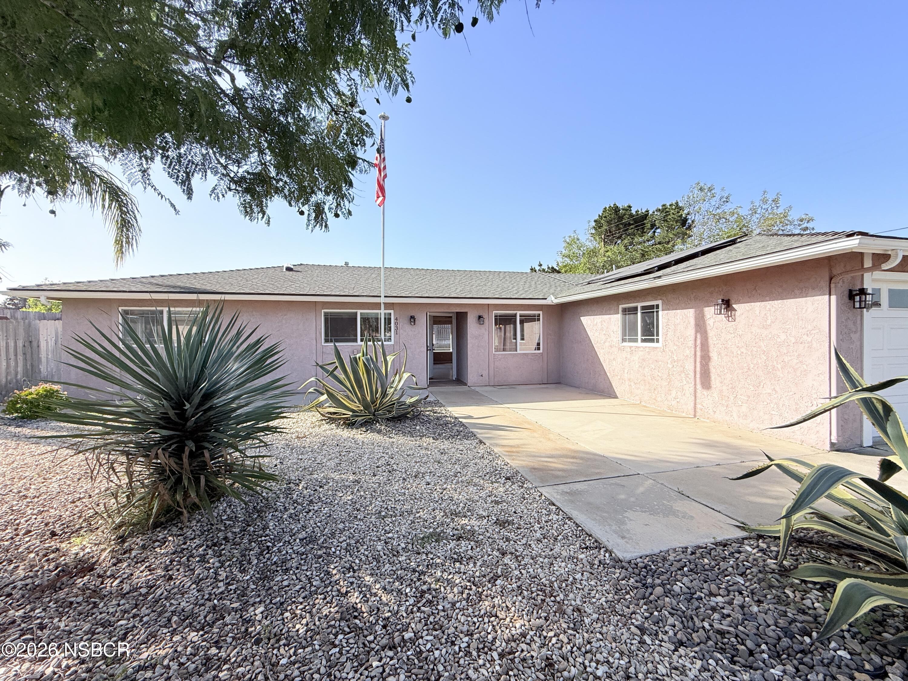 4031 Hillview Road Santa Maria, CA 93455 - Photo 1 of 16 a front view of a house with garden