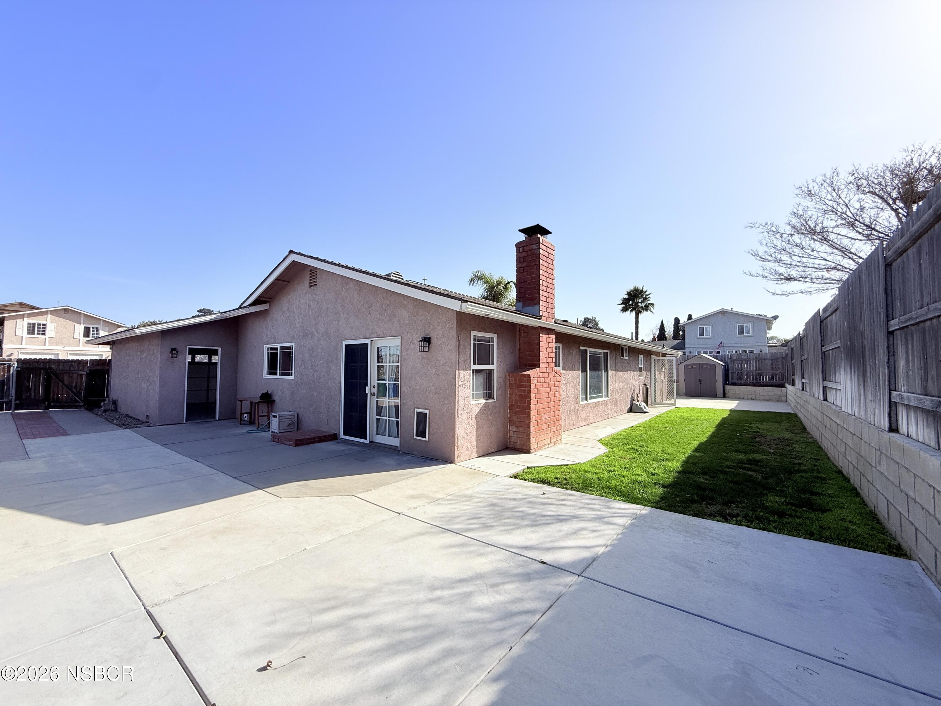 4031 Hillview Road Santa Maria, CA 93455 - Photo 11 of 16 a front view of a house with a yard and garage