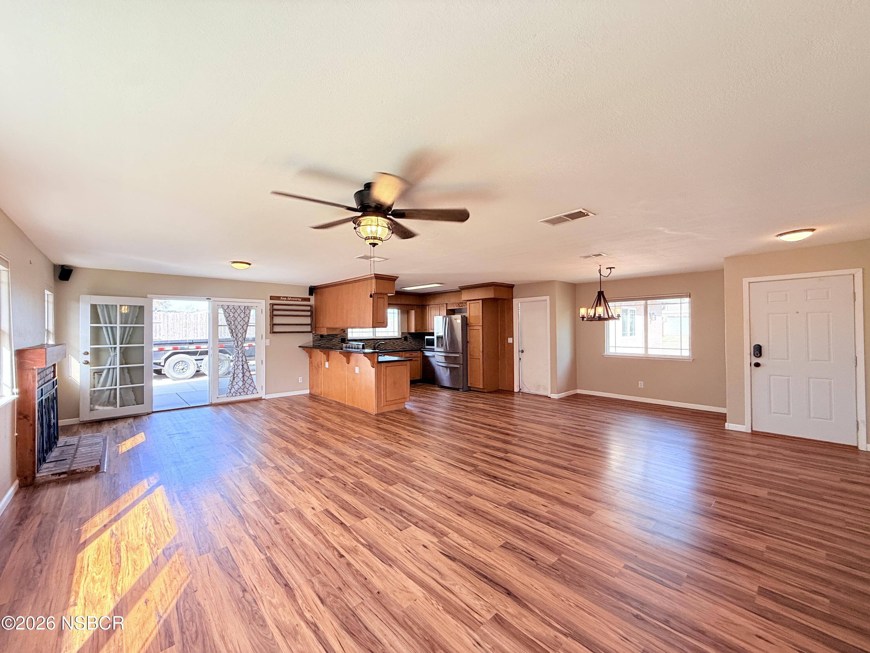 4031 Hillview Road Santa Maria, CA 93455 - Photo 2 of 16 a view of empty room with wooden floor and fan