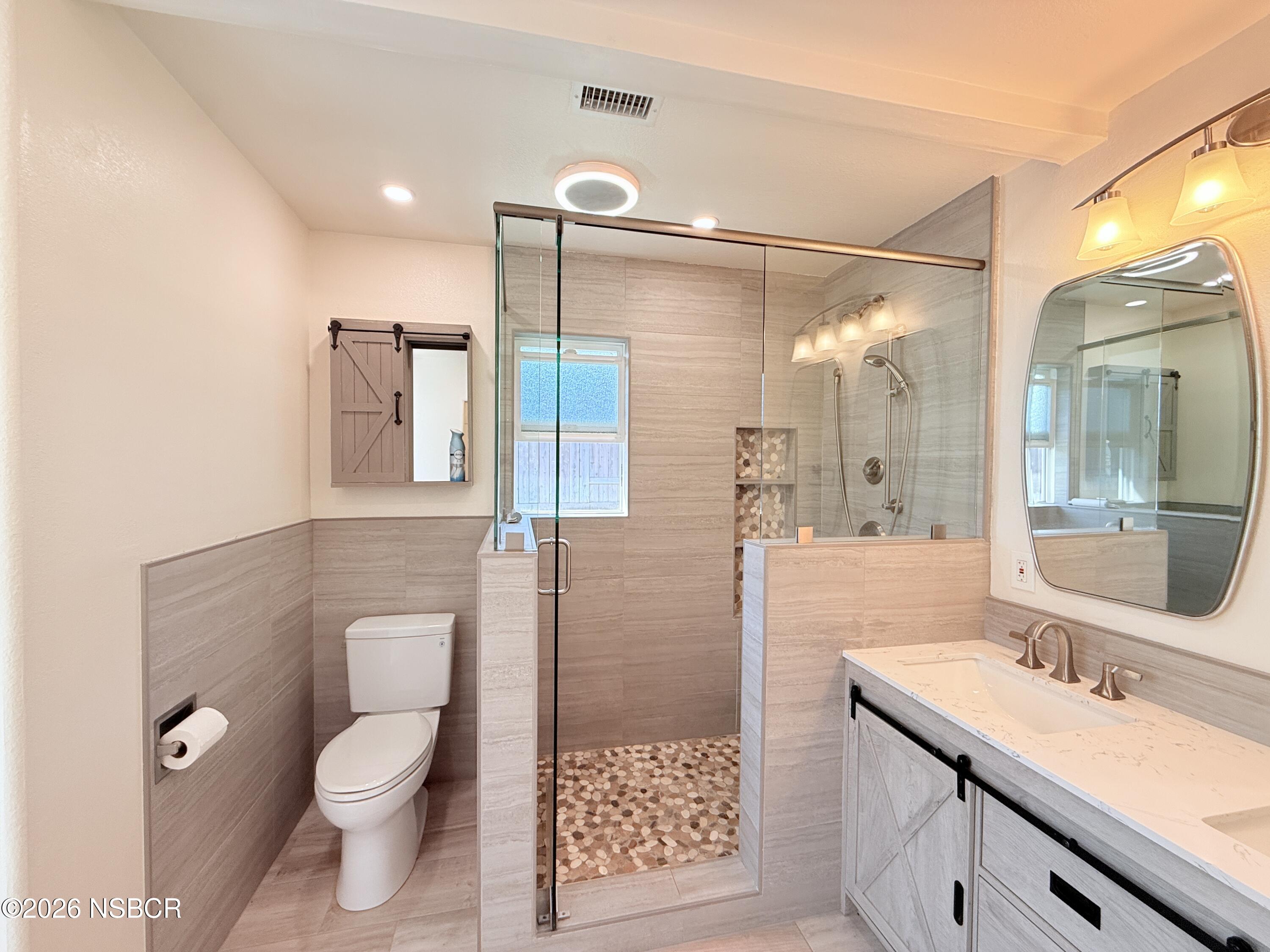 4031 Hillview Road Santa Maria, CA 93455 - Photo 10 of 16 a bathroom with a sink a toilet and shower