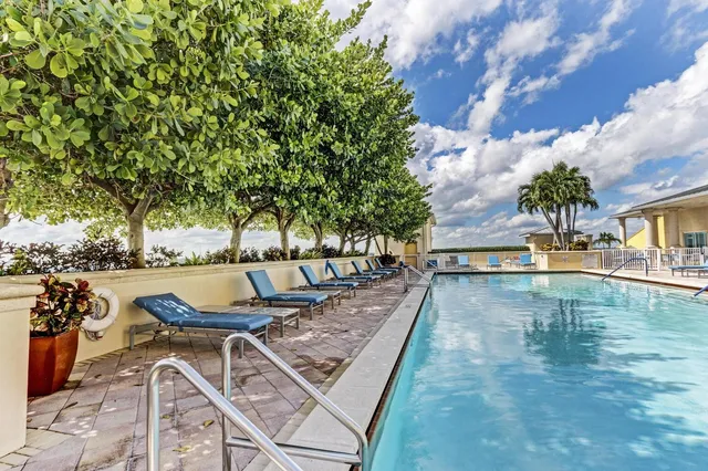 a kitchen with stainless steel appliances granite countertop a stove and a refrigerator