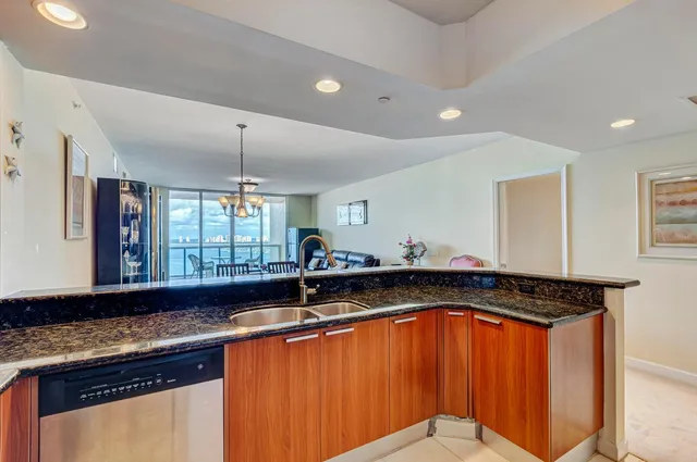 a bedroom with a bed and a ceiling fan