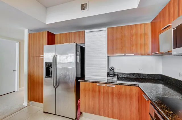 a bathroom with a tub double vanity sink and a mirror