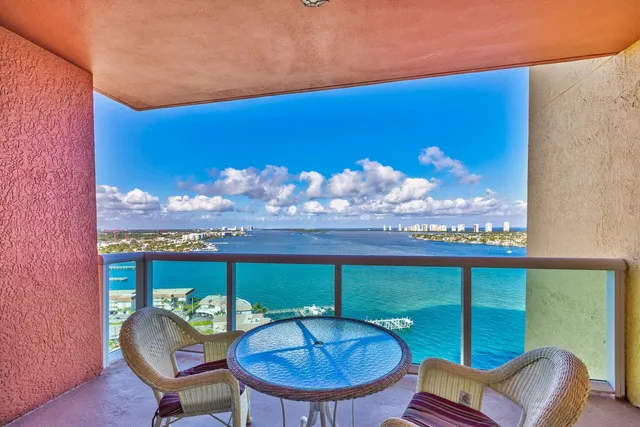 an outdoor space with furniture and umbrella