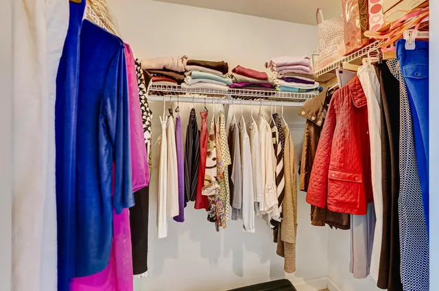 a bathroom with a granite countertop sink mirror and vanity