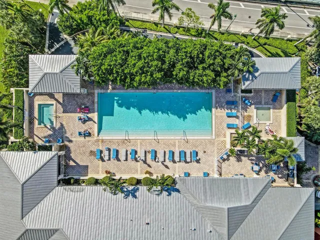 a dinning table and chairs in the patio of the house