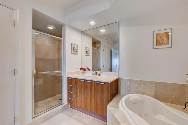 a spacious bedroom with a bed and a window