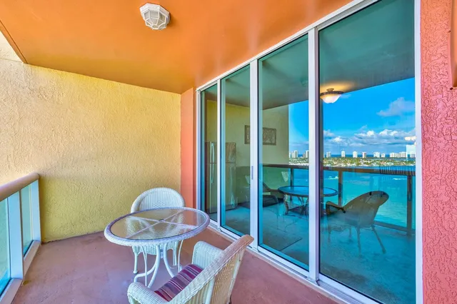 a kitchen with stainless steel appliances granite countertop a sink and a refrigerator