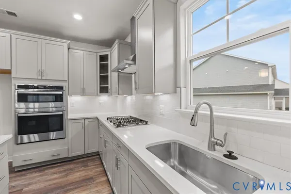 a view of a hallway with a staircase