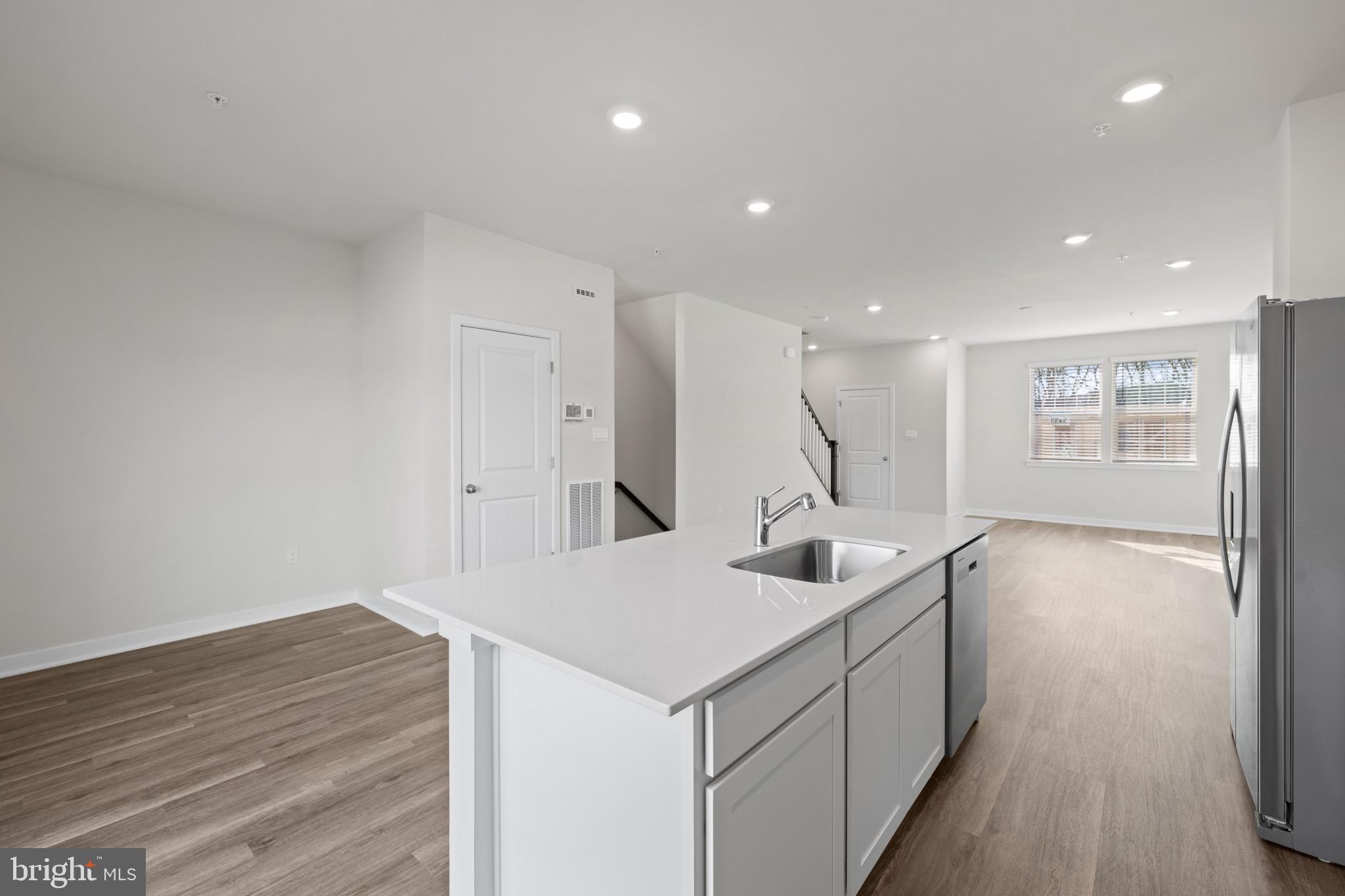7512 Fern Gully Way Brandywine, MD 20613 - Photo 12 of 26 a kitchen with a sink and wooden floor