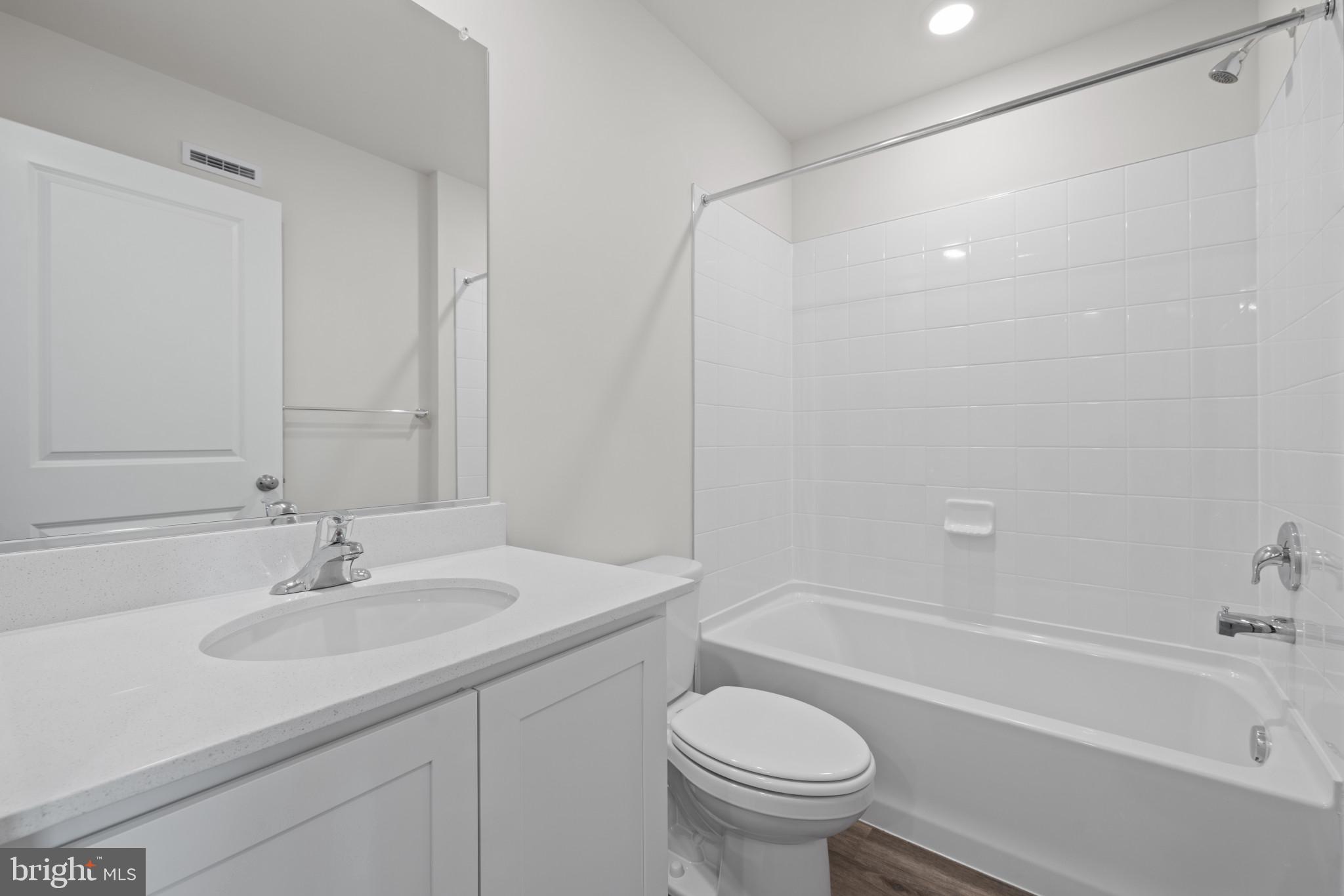 7512 Fern Gully Way Brandywine, MD 20613 - Photo 17 of 26 a bathroom with a sink toilet and bathtub