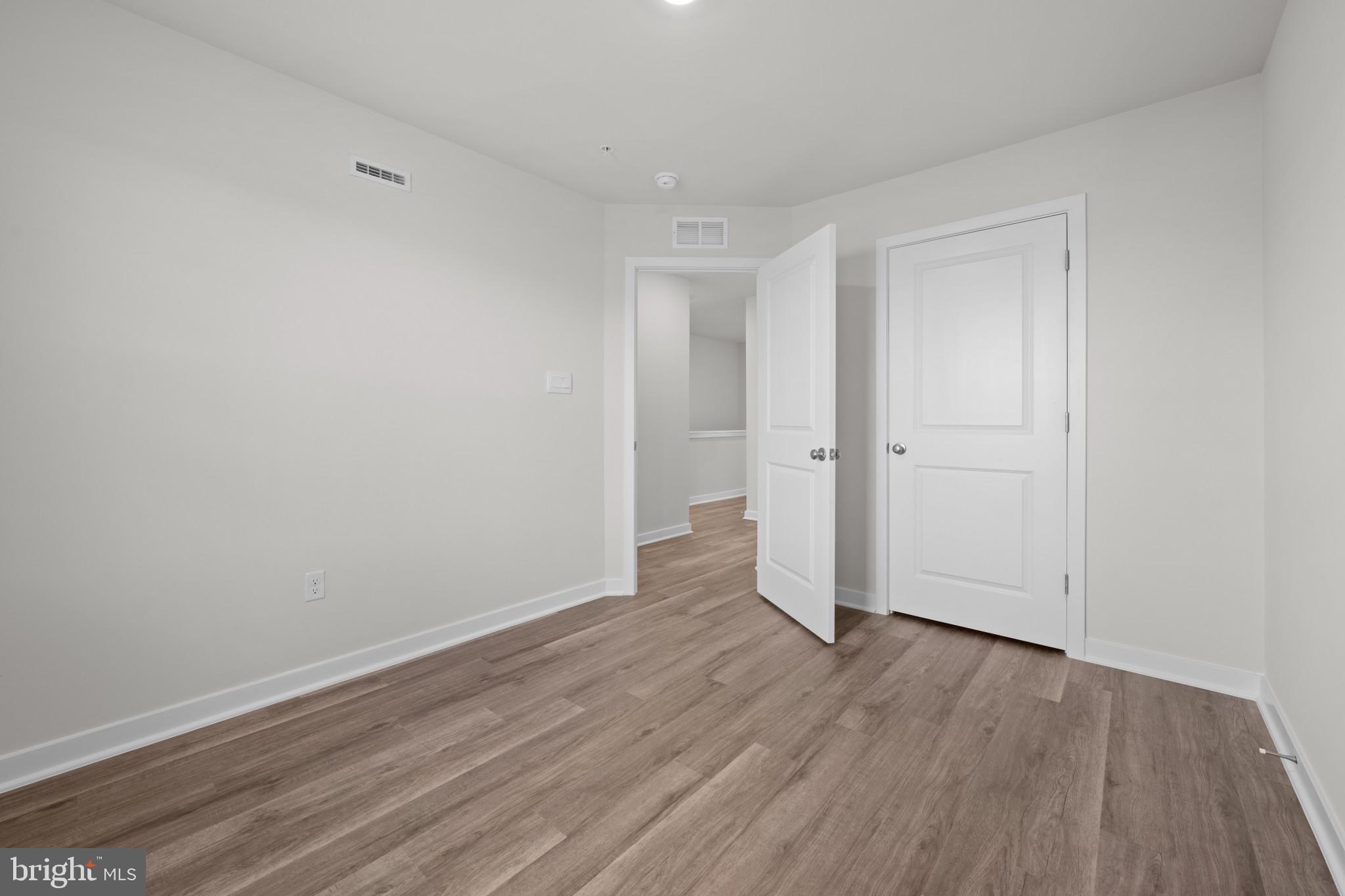 7512 Fern Gully Way Brandywine, MD 20613 - Photo 18 of 26 a view of empty room with wooden floor