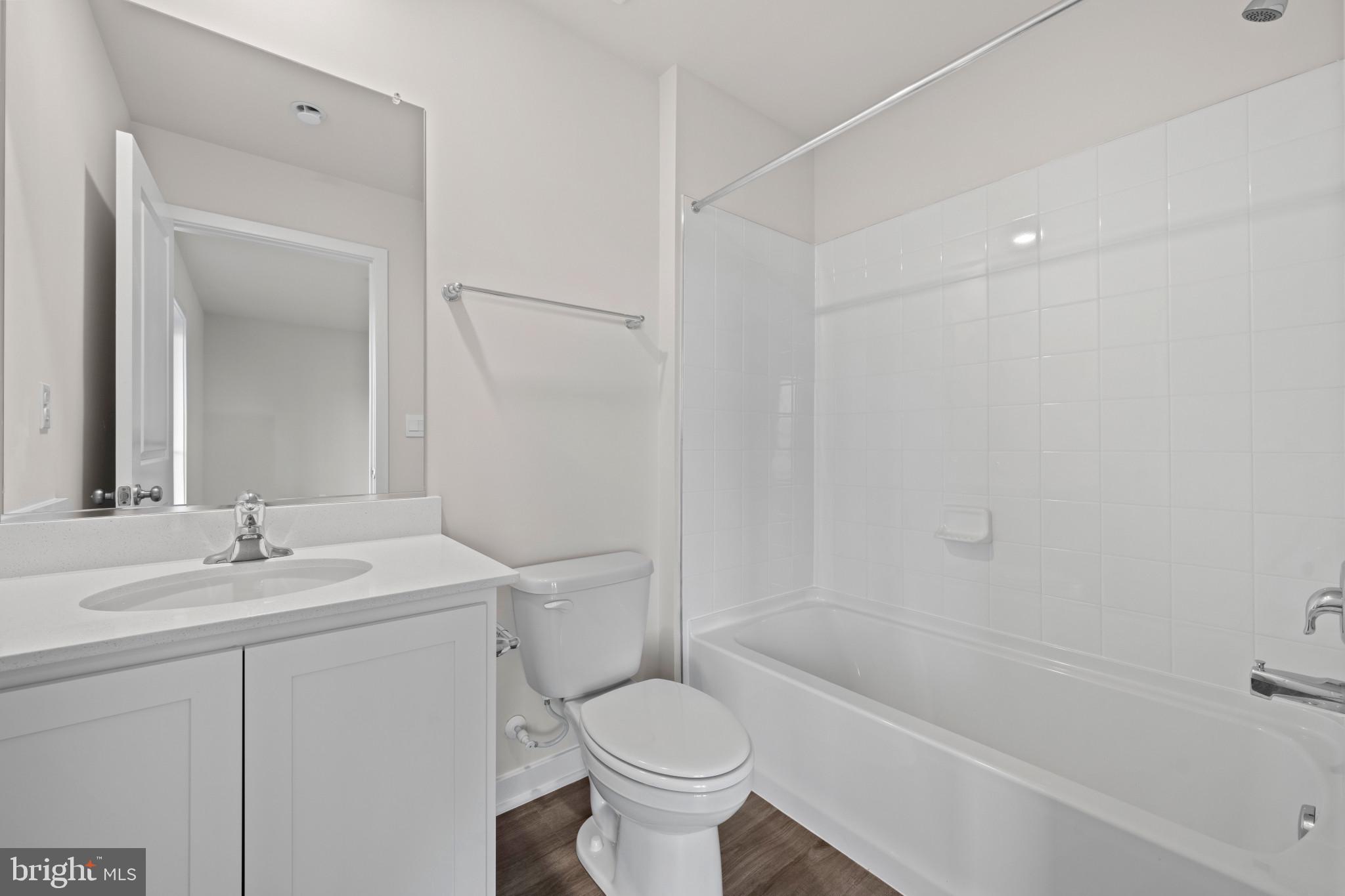 7512 Fern Gully Way Brandywine, MD 20613 - Photo 7 of 26 a bathroom with a sink toilet vanity and tub