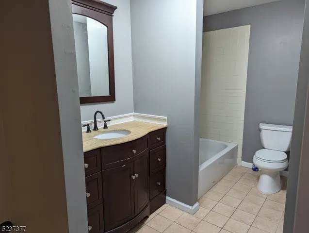 a bathroom with a sink a toilet and a bathtub