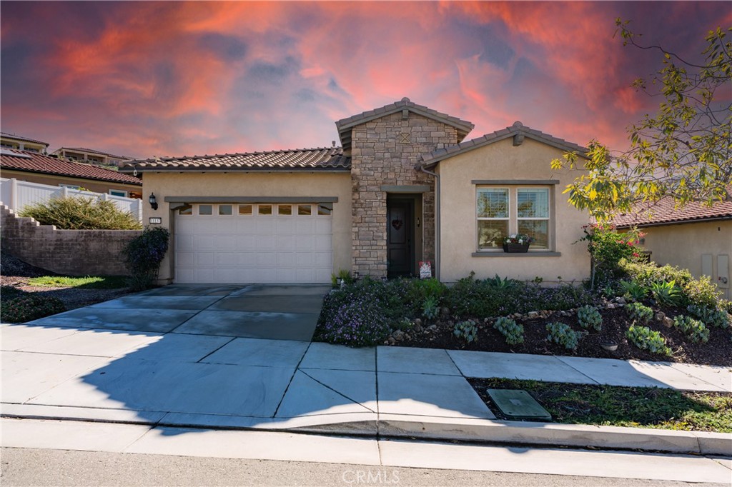 11137 Briar Rose Court Corona, CA 92883 - Photo 1 of 75 a front view of a house with a yard