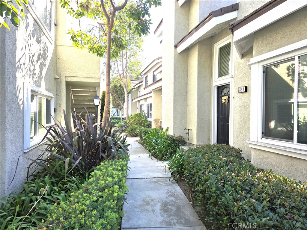 388 Fallingstar Irvine, CA 92614 - Photo 27 of 29 a view of a pathway with a flower garden