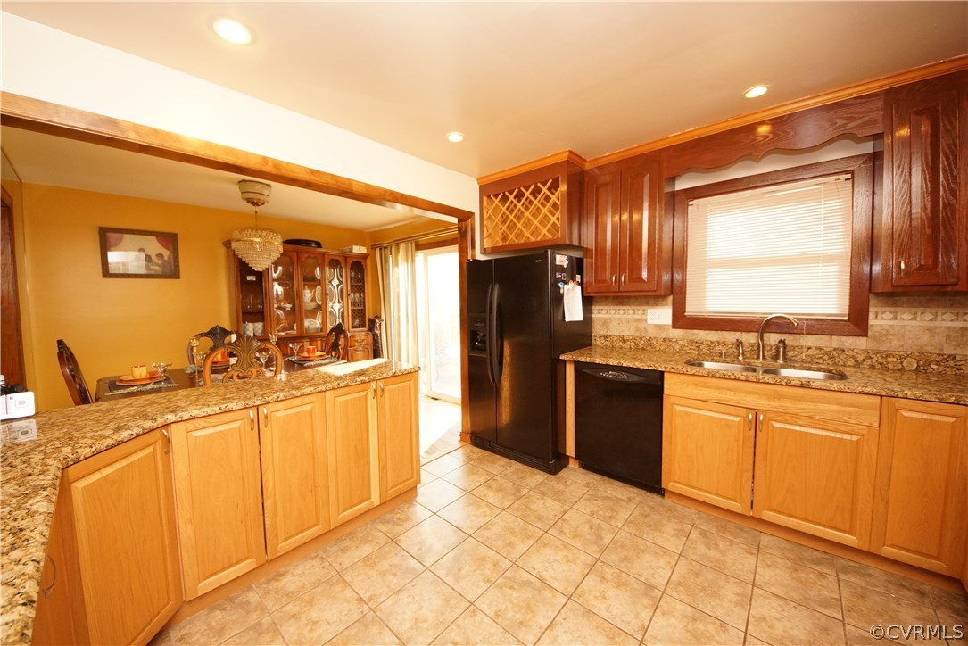 6320 Barrister Road Chesterfield, VA 23832 - Photo 7 of 22 a kitchen with stainless steel appliances granite countertop a sink stove and refrigerator
