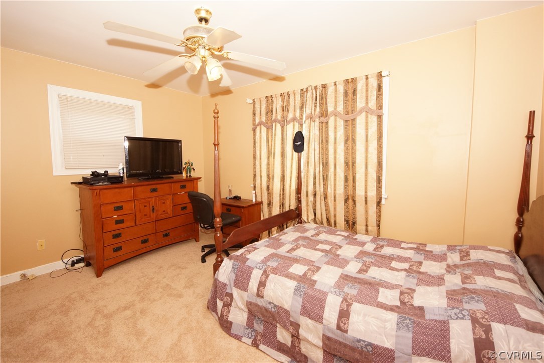 6320 Barrister Road Chesterfield, VA 23832 - Photo 10 of 22 a bedroom with a bed and a flat tv screen on wall
