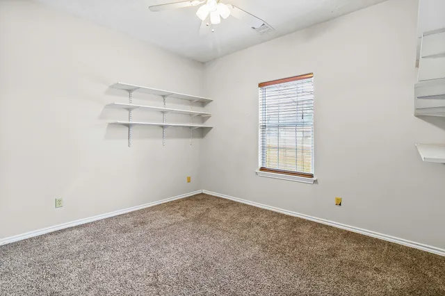 an empty room with a empty space and a window