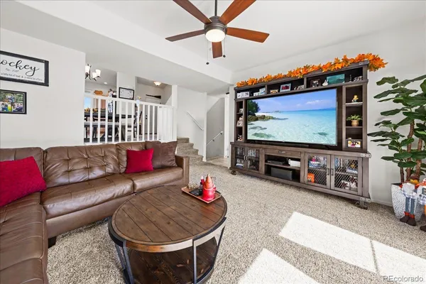 a bathroom with a granite countertop toilet sink and mirror