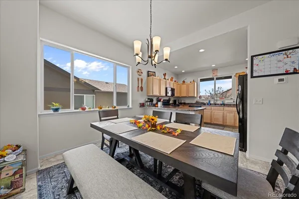 a kitchen with stainless steel appliances granite countertop a refrigerator sink and cabinets
