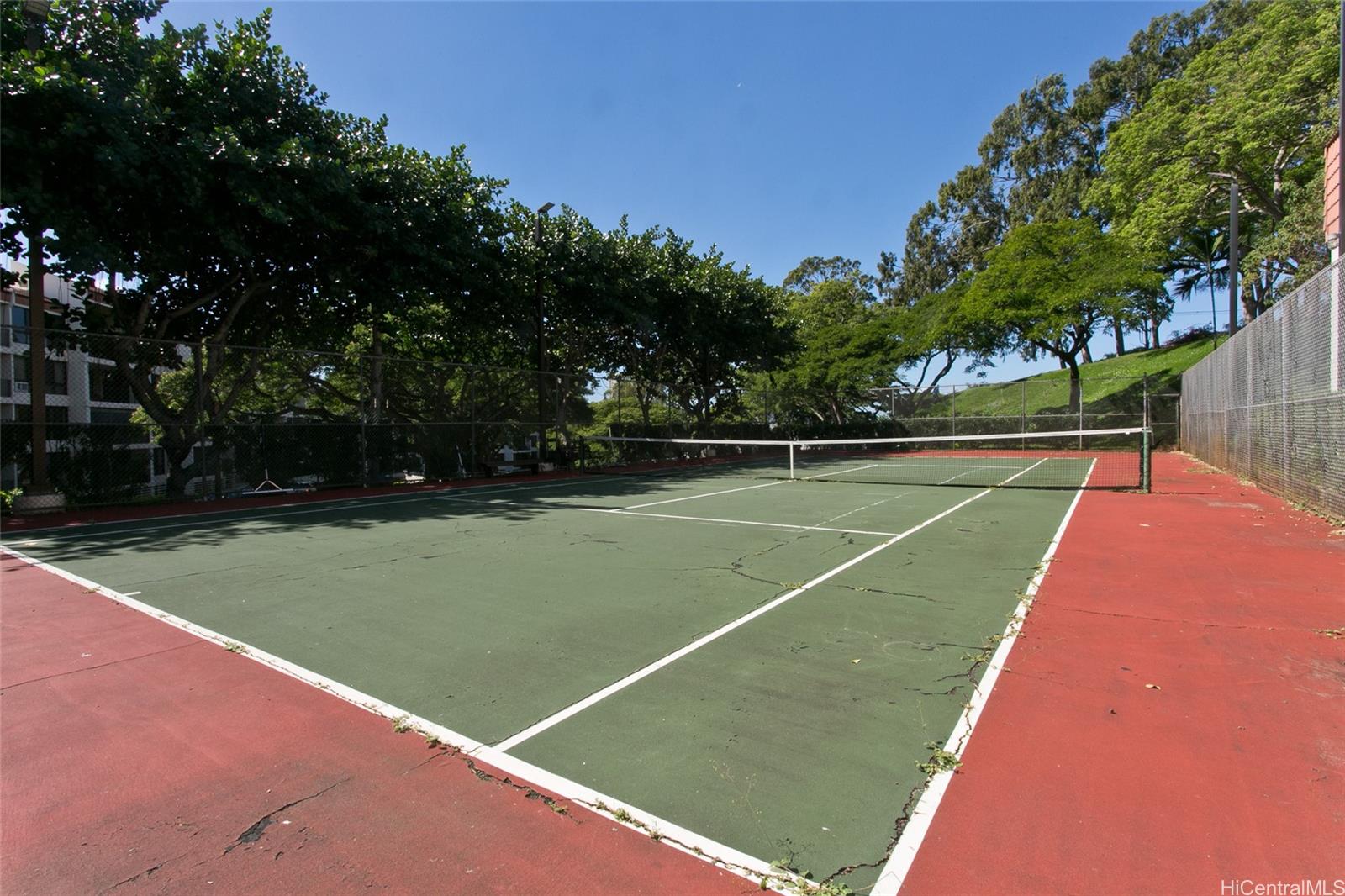 3138 Waialae Avenue, Unit 330 Honolulu, HI 96816 - Photo 15 of 17 a view of tennis court with trees in the background