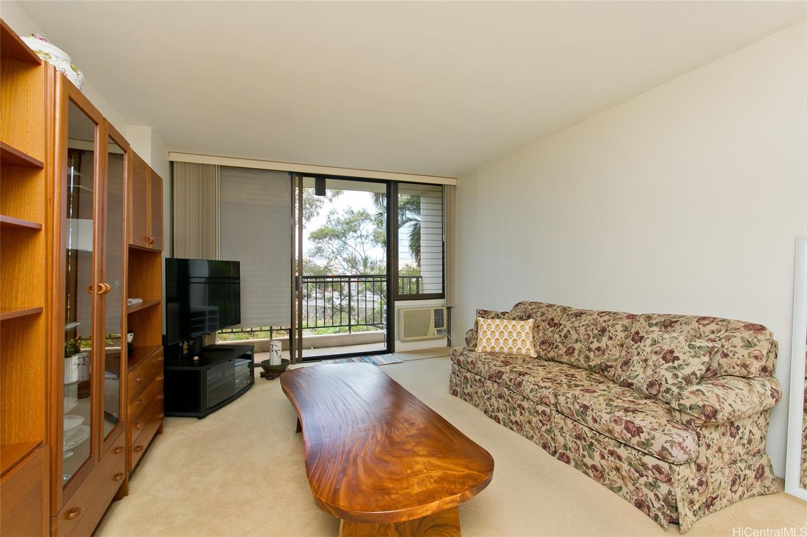 3138 Waialae Avenue, Unit 330 Honolulu, HI 96816 - Photo 2 of 17 a living room with furniture window and a flat screen tv