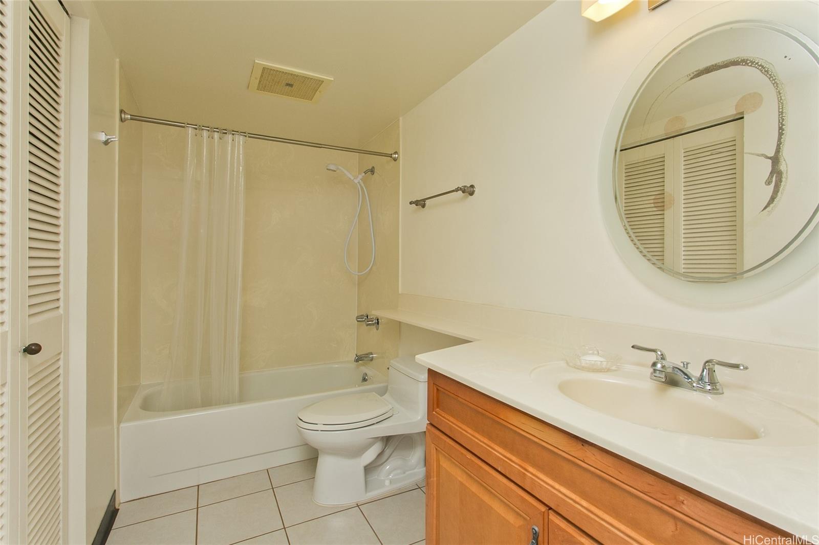 3138 Waialae Avenue, Unit 330 Honolulu, HI 96816 - Photo 7 of 17 a bathroom with a sink a toilet and shower