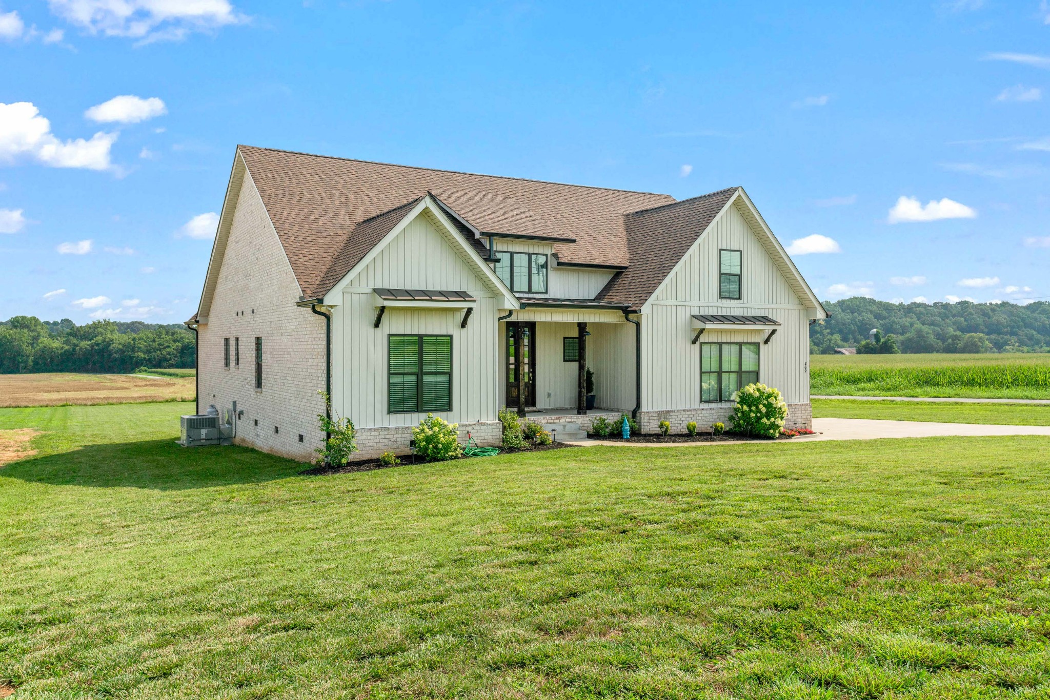 269 Aplin Branch Road Cottontown, TN 37048 - Photo 54 of 56 a view of a house with a yard and a large tree
