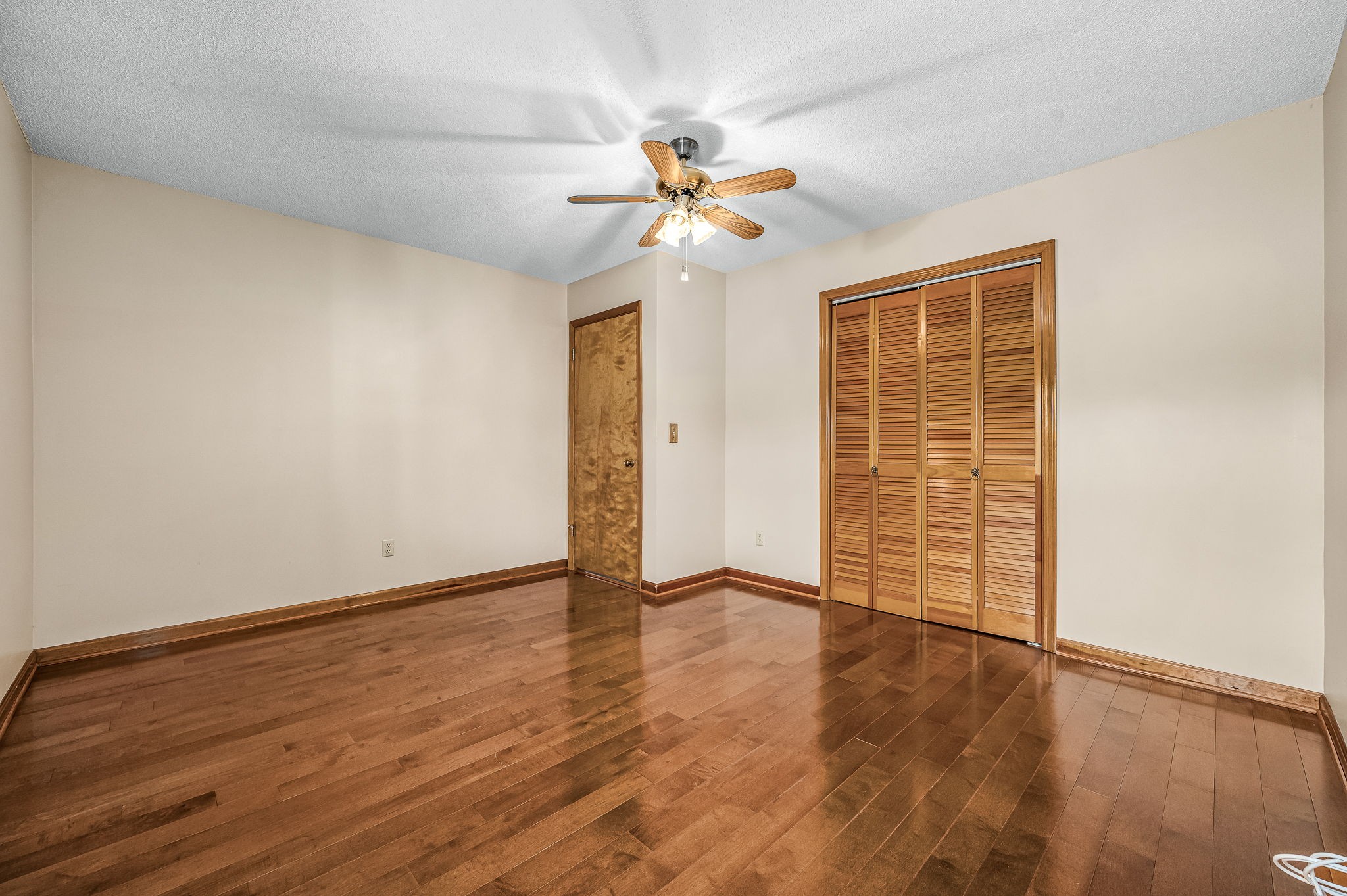 1246 Oakwood Road Joelton, TN 37080 - Photo 15 of 61 an empty room with wooden floor closet and fan