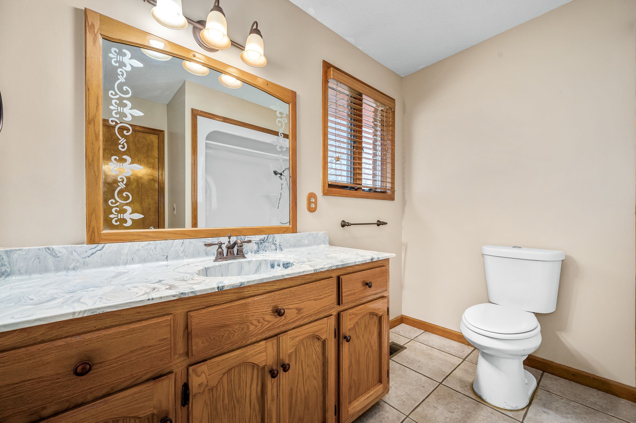 1246 Oakwood Road Joelton, TN 37080 - Photo 20 of 61 a bathroom with a toilet sink and mirror