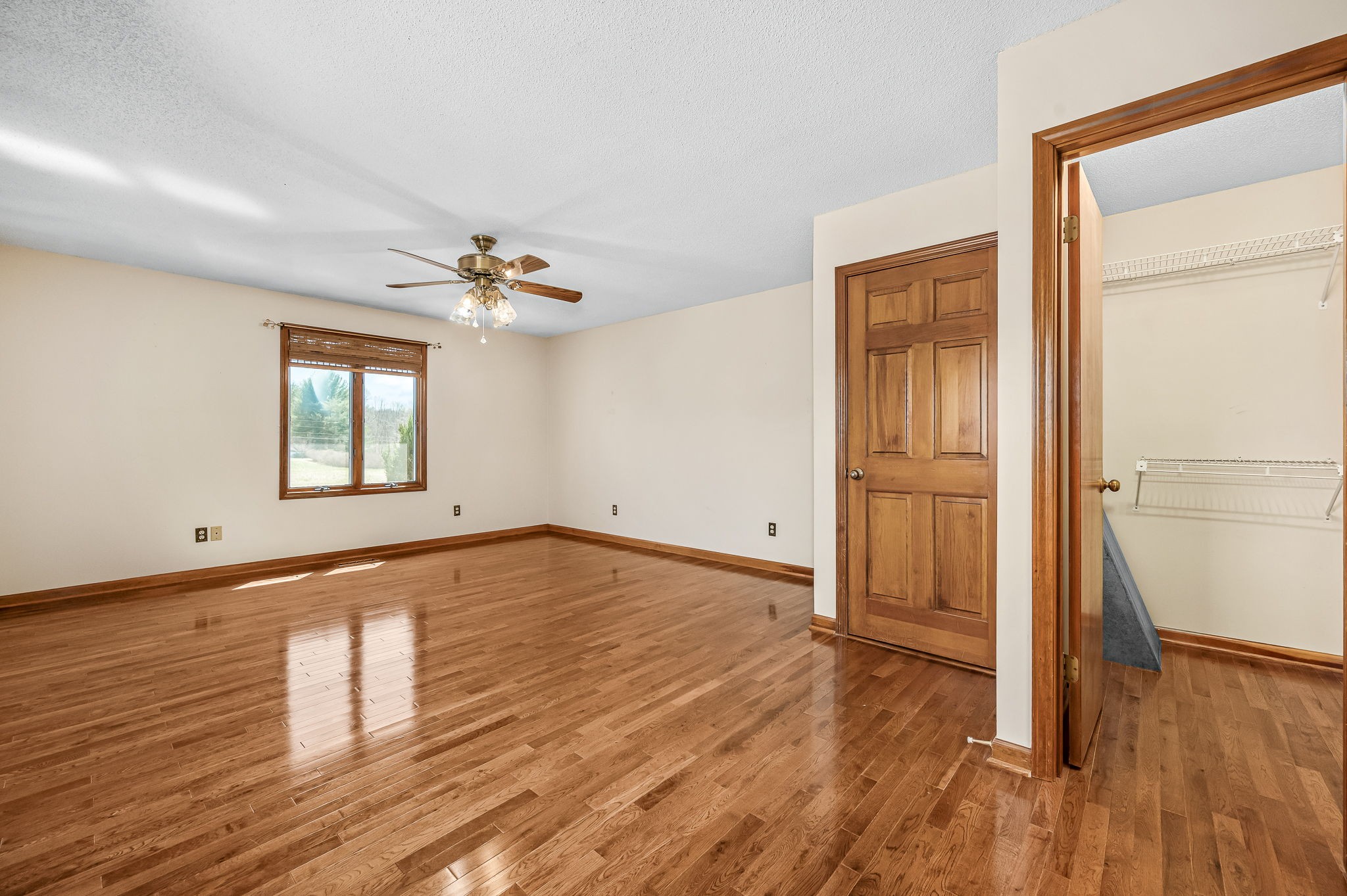 1246 Oakwood Road Joelton, TN 37080 - Photo 22 of 61 an empty room with wooden floor and windows