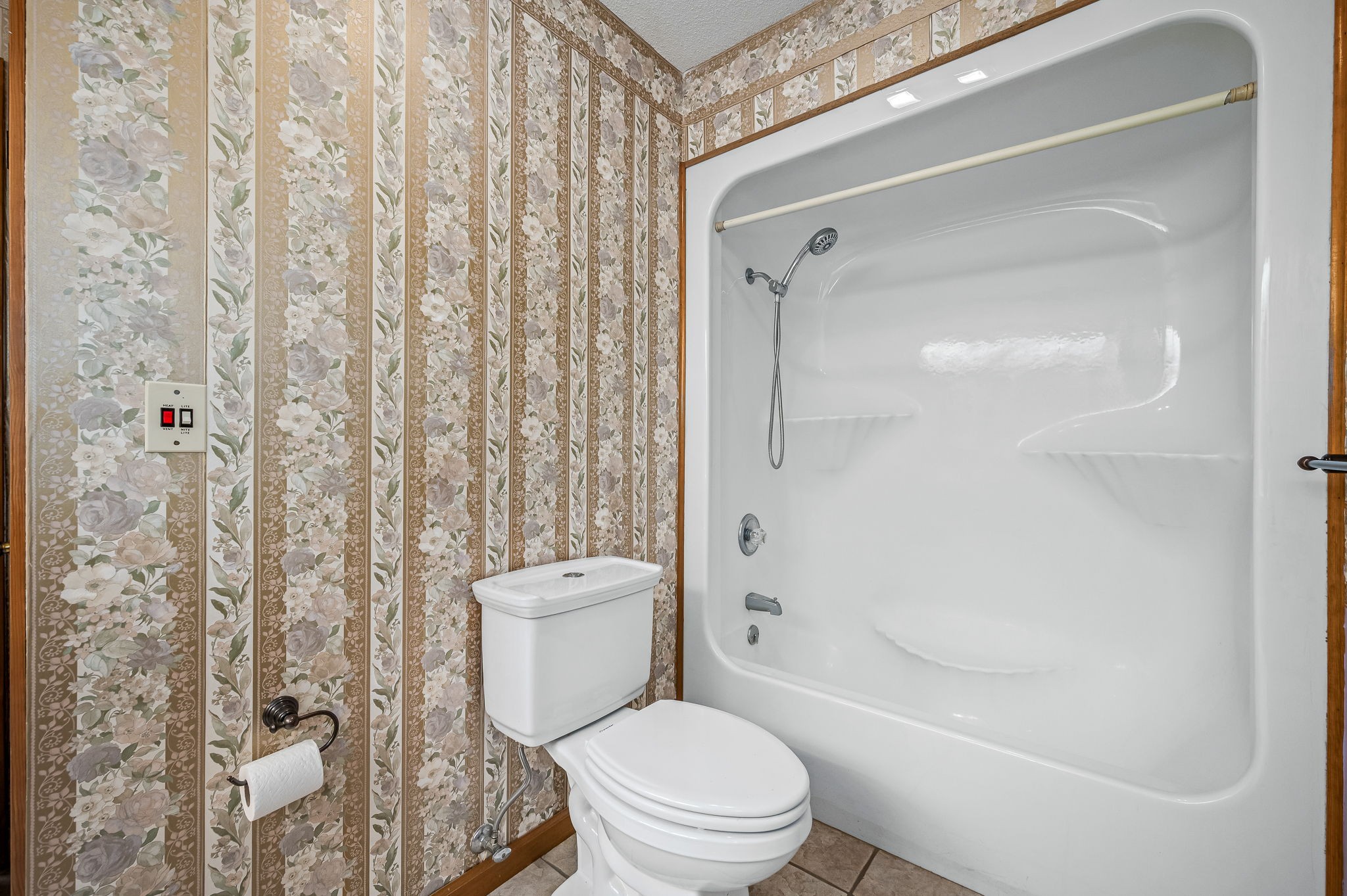 1246 Oakwood Road Joelton, TN 37080 - Photo 26 of 61 a white toilet sitting next to a bath tub