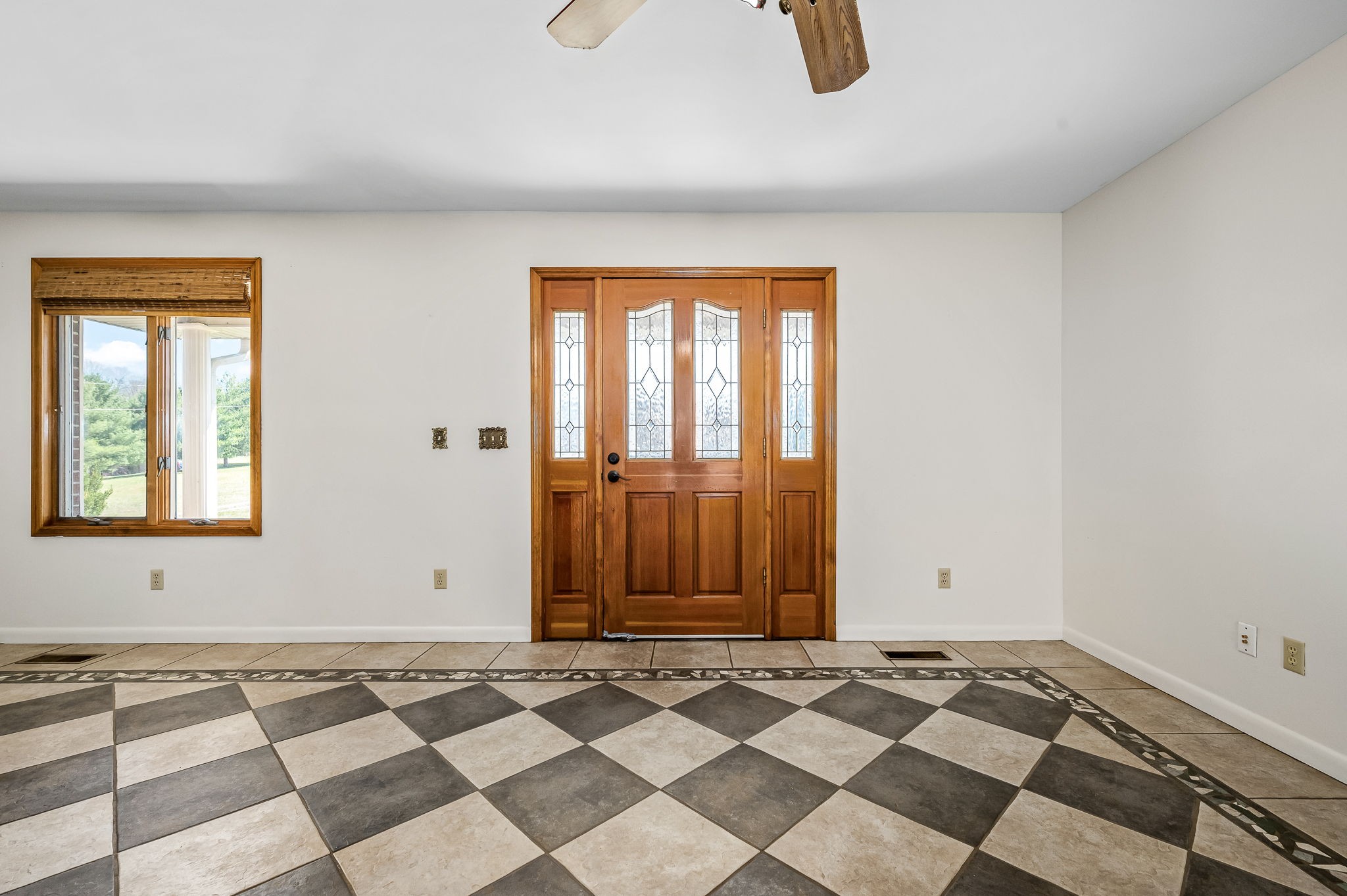 1246 Oakwood Road Joelton, TN 37080 - Photo 3 of 61 a view of a livingroom with wooden floor and a window