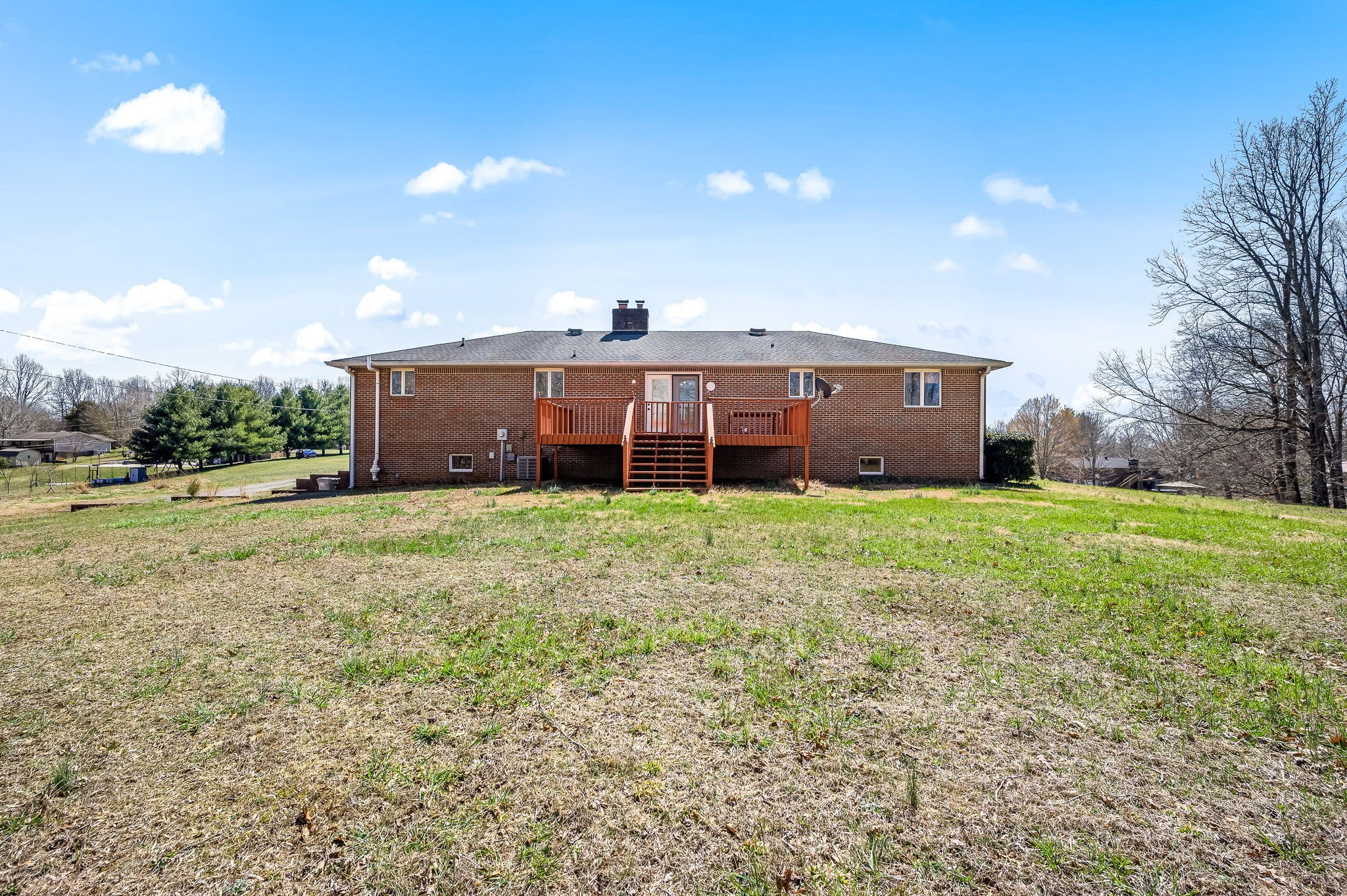 1246 Oakwood Road Joelton, TN 37080 - Photo 45 of 61 a view of a house with a big yard and large trees