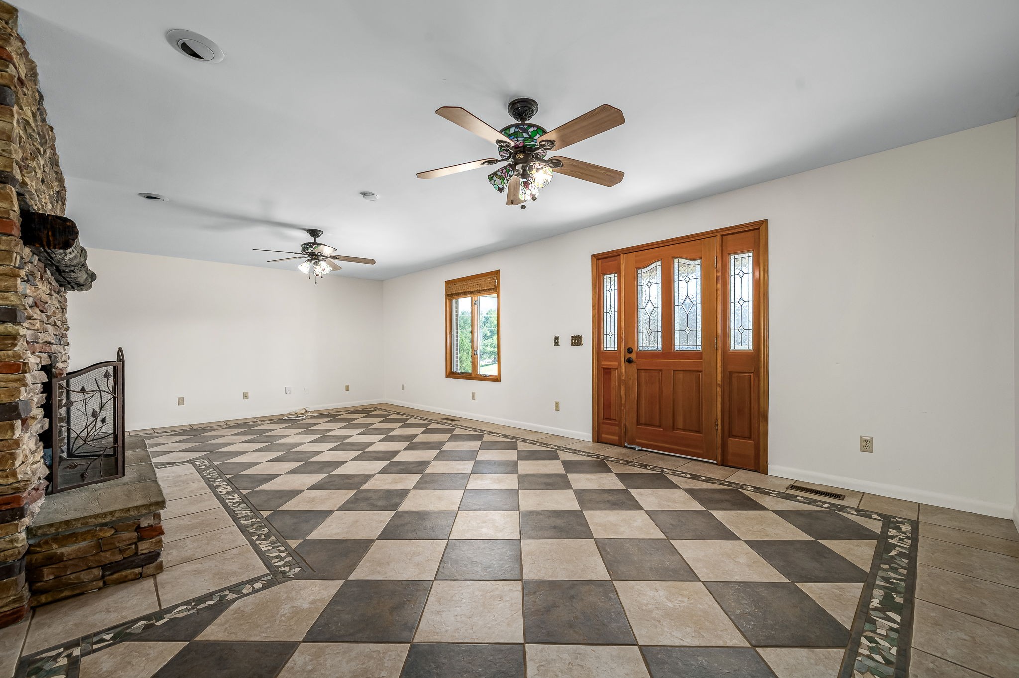 1246 Oakwood Road Joelton, TN 37080 - Photo 5 of 61 a view of a livingroom with a window and a ceiling fan