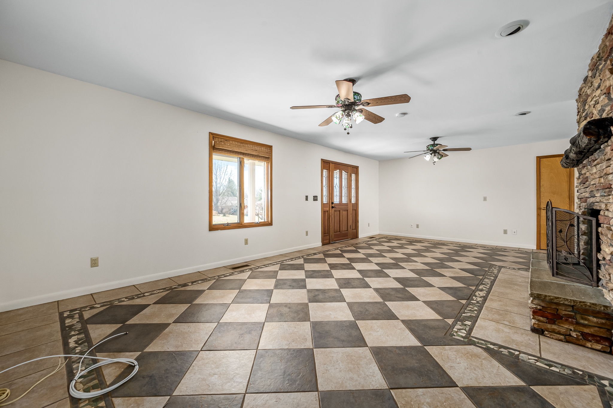 1246 Oakwood Road Joelton, TN 37080 - Photo 6 of 61 a view of a livingroom with a dinning area windows and a ceiling fan