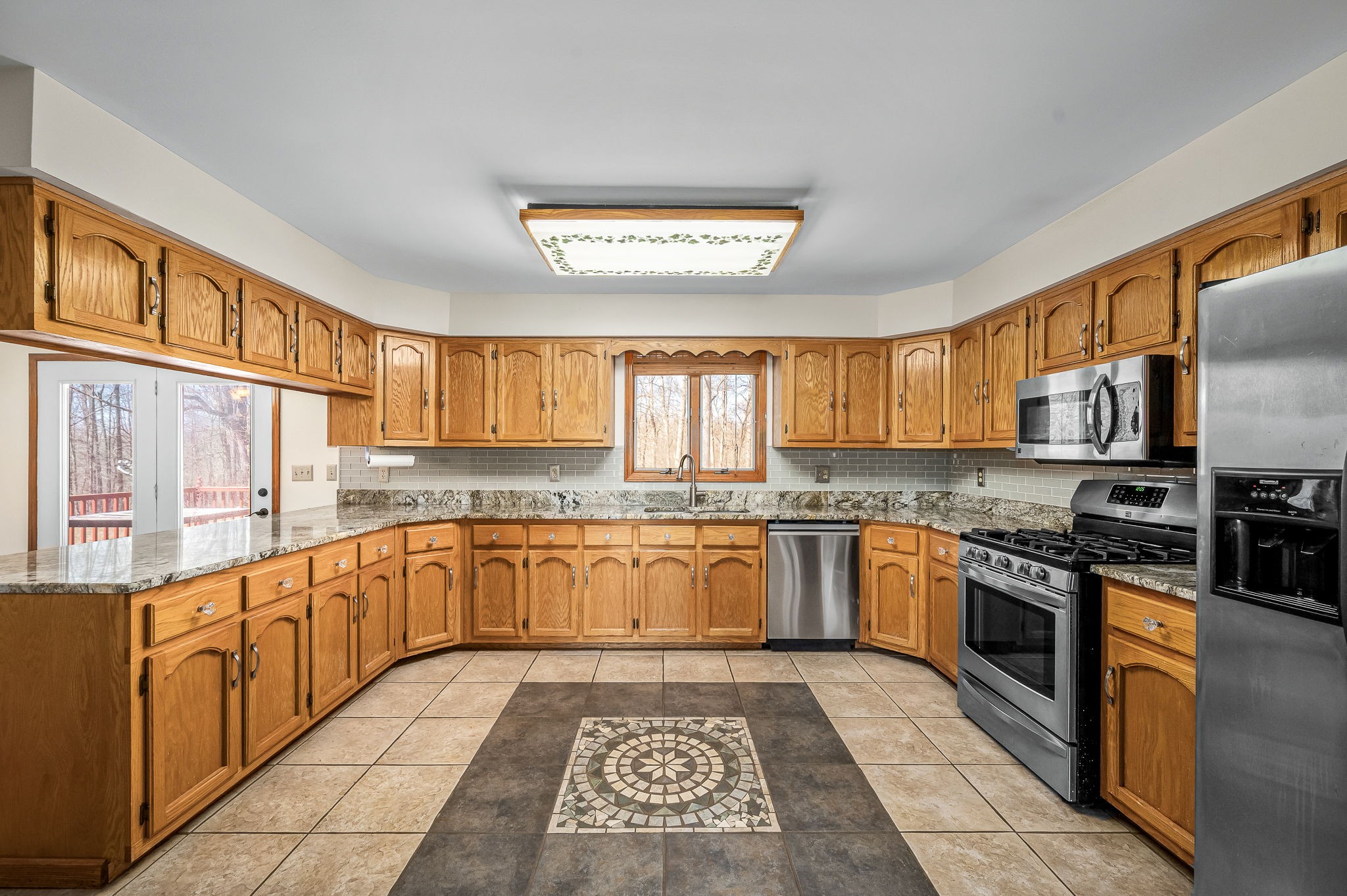 1246 Oakwood Road Joelton, TN 37080 - Photo 9 of 61 a large kitchen with granite countertop lots of counter top space