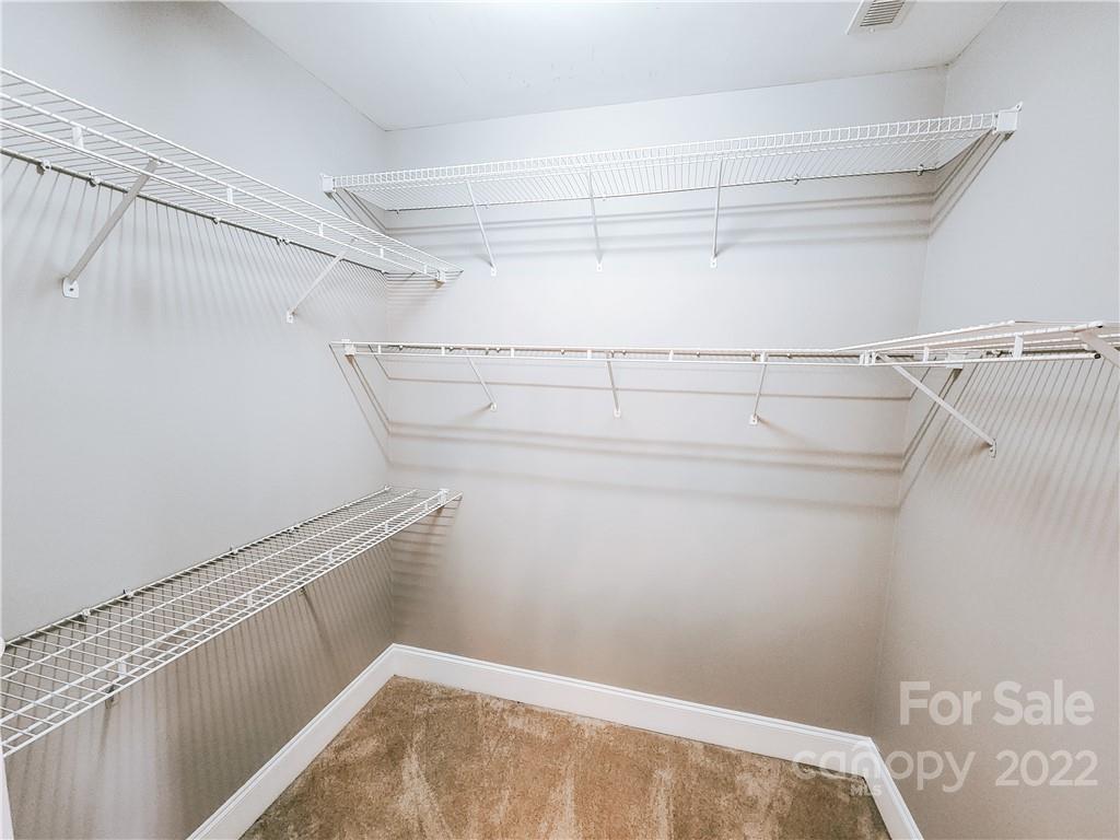 8408 Forest Shadow Circle Cornelius, NC 28031 - Photo 11 of 24 a view of a room with racks on the wall