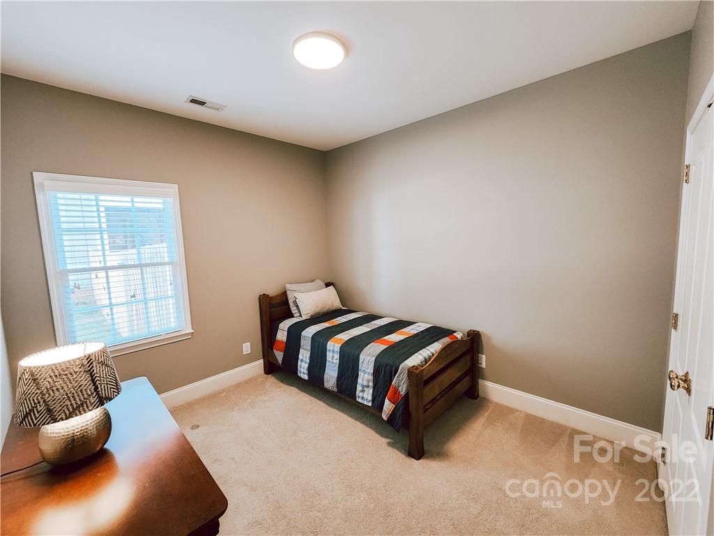8408 Forest Shadow Circle Cornelius, NC 28031 - Photo 13 of 24 a room with a bed and a window
