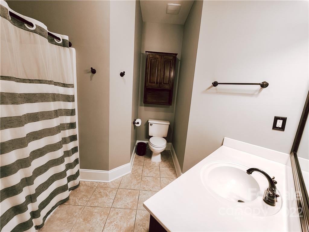 8408 Forest Shadow Circle Cornelius, NC 28031 - Photo 14 of 24 a bathroom with a sink and toilet