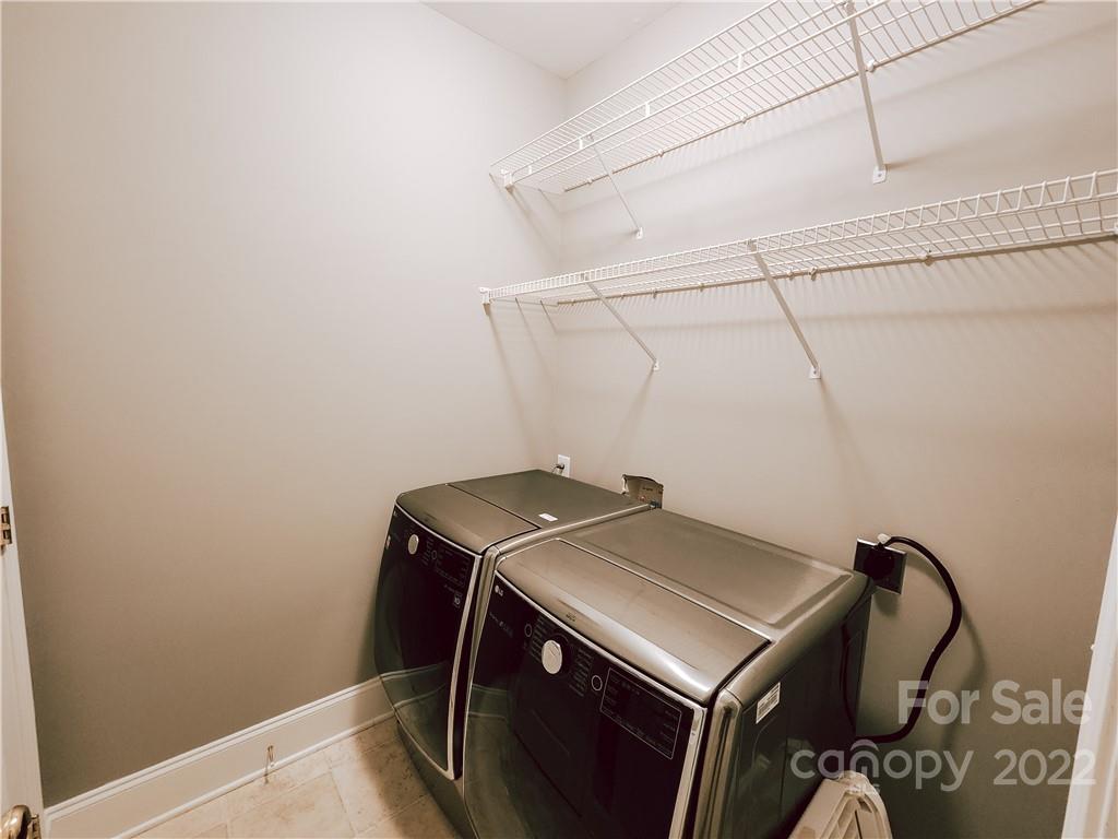 8408 Forest Shadow Circle Cornelius, NC 28031 - Photo 16 of 24 a utility room with dryer and washer