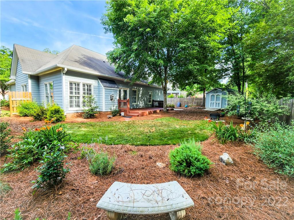 8408 Forest Shadow Circle Cornelius, NC 28031 - Photo 18 of 24 a front view of a house with a yard and trees