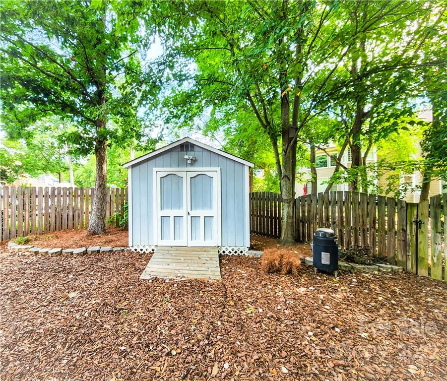 8408 Forest Shadow Circle Cornelius, NC 28031 - Photo 19 of 24 a backyard of a house with barbeque oven
